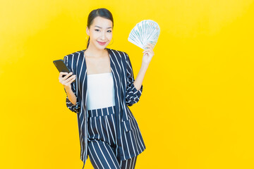 Portrait beautiful young asian woman smile with a lot of cash and money