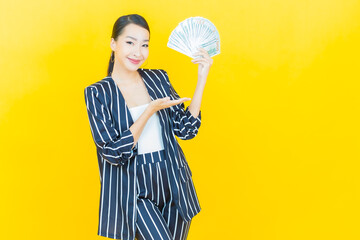 Portrait beautiful young asian woman smile with a lot of cash and money