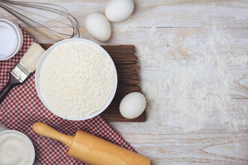 Homemade flour mixture on a wooden table, viewed from above.