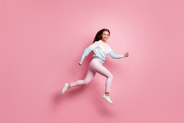 Fototapeta na wymiar Full body profile side photo of attractive active young woman run jump up isolated on pastel pink color background
