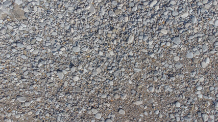 Gray gravel road construction site texture for background, wallpaper, material for texture 3D