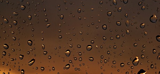 water droplets on a brown background glass