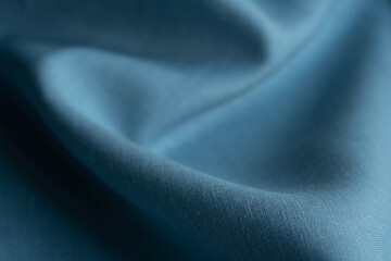 Linen fabric, blue background. Soft linen blue fabric texture. Textured fabric background. Macro with shallow dof
