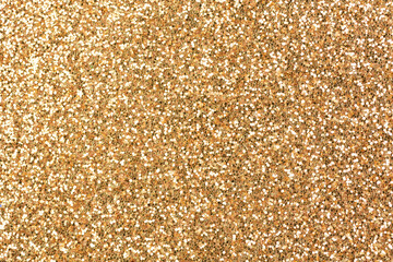 Bronze glitter texture background, glitter or sandpapper high detailed surface, shining glowing effects concept