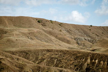 Empty gray hills landscape on a sunny day.
