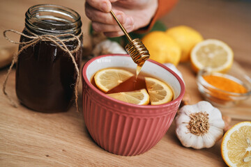 Honey added to the cup of hot tea
