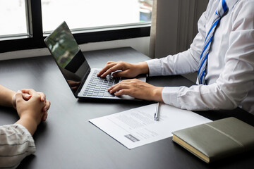 Managers print information from applicants' resumes coming in for an interview for an accounting position at a company, HR managers reviewing applicants' resumes, job interview ideas and recruiting.