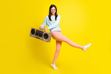 Full length body size photo girl dancing keeping retro tape recorder isolated vibrant yellow color background