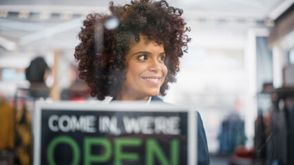 Stylish African American Clothing Shop Manager Changes Fashion Store Sign on the Door to Open. Professional Shop Sales Retail Assistant Working. Small Business Owner at Shopping Mall.