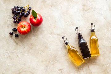 Red wine and apple cider vinegar with grapes and red apples