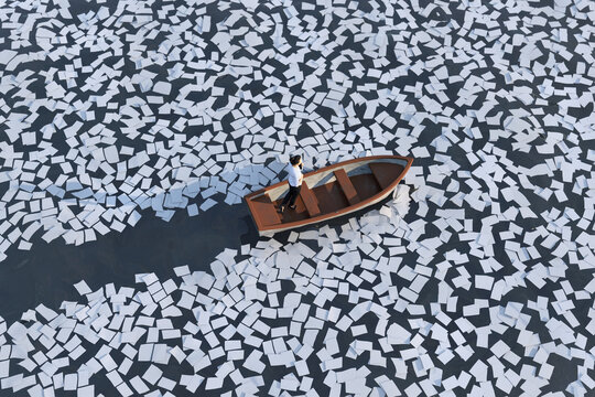 businesswoman on a boat sailing the ocean of paper sheets 