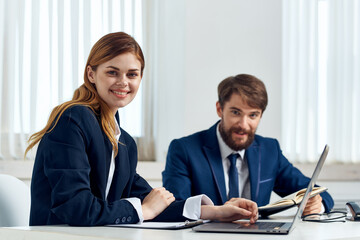 colleagues work together in front of laptop professionals technology