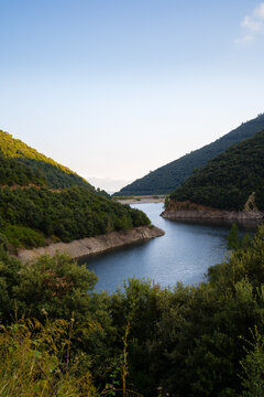 reservoir de Vallfornis with the summits of the mountains that surround it illuminated by the sun, Canoves and Samalus Catalonia, Spain