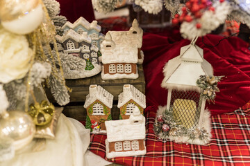 Close up of Christmas decorations with gingerbread houses and white candle
