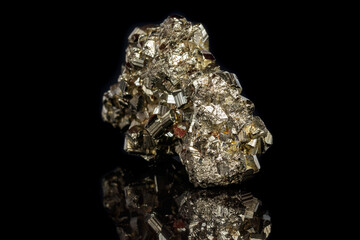 Macro mineral stone Pyrite on a black background