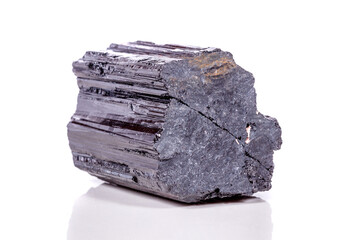 macro mineral stone sherle, schorl, black tourmaline on white background