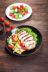 different types of salads on the table menu vegetables, meat, salad fresh portion ready to eat meal snack copy space food background rustic. top view keto or paleo diet