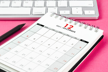 December 2021 desk calendar with pencil.