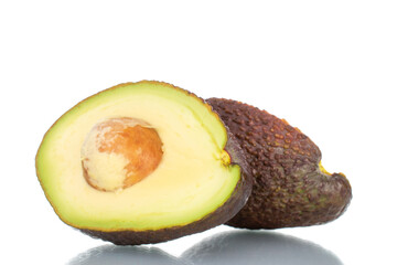 Two halves of organic ripe avocado, close-up, isolated on white.