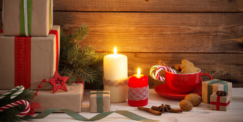 Christmas gifts and decorations on wooden background