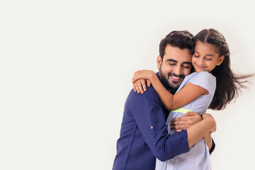 A DAUGHTER AND FATHER HAPPILY EMBRACING EACH OTHER