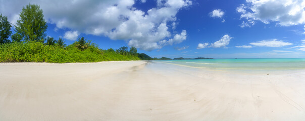 tropical beach at anse volbert on praslin on the seychelles