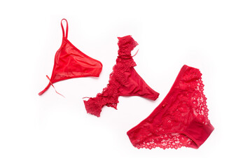 Panties and bra under the lace of red color set of female lower intimate romantic underwear on a...