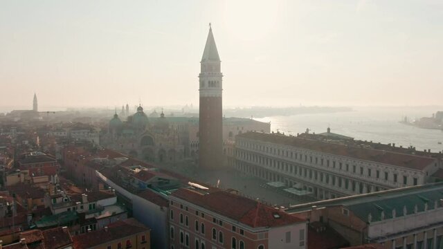 Establishing Aerial Skyline of Venice, Italy, European Romantic Touristic City Destination. Piazza San Marco with St Mark's Basilica and Campanile, Islands and Adriatic Sea. 4K Panoramic shot