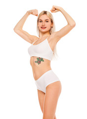 Obraz premium Young beautiful woman in sports underwear isolated on white background