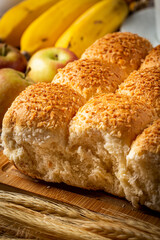 Breakfast table with coconut bread and fruits.