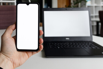 Empty white screen smartphone and laptop for mockup. Mobile phone and PC mockup