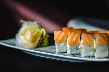 Maki and nigiri sushi variety with salmon, shrimp, avocado and tuna at a sushi restaurant