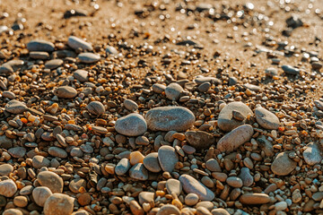 Beautiful pebbles on the beach during sunset