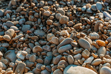 Beautiful pebbles on the beach during sunset