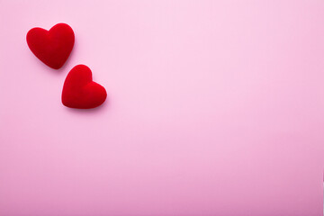 Valentine's Day. Love background. Gifts in the form of hearts on a pink background with the...