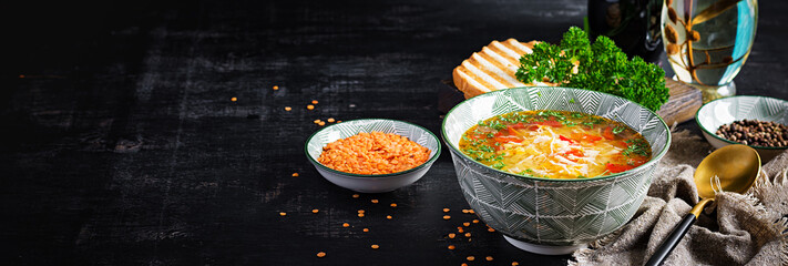 Chicken soup with red lentils and paprika. Traditional Mediterranean food. Healthy food. Banner.