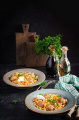 Italian traditional ditalini pasta with meatballs in tomato sauce and vegetables in bowl.  Ditalini pasta and beef balls  with marinara tomato sauce.