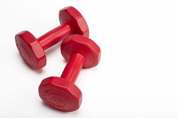 Abandoned red dumbbell on a white background , Neglect of health care concept