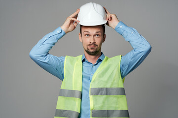 male builder in a white helmet engineer safety isolated background