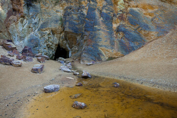 Multicolored scale with cave and lake section.