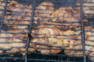 Food at the stake. Grilled chicken.