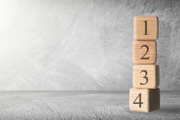 The order of priority in any activity is correct. A person sets wood blocks