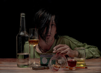 Black hair man with alcohol brown wooden table