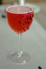 Red cocktail decorated with dried fruits at a restaurant