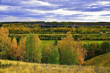 Fototapeta na wymiar Autumn outfit of the Sylva river valley. View from the Bilniki tract.