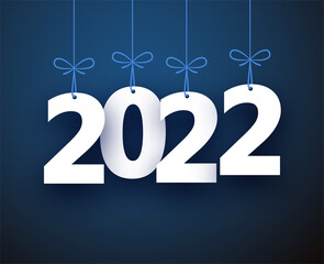 Hanging 2022 sign on blue background.