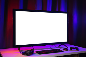 Blank screen display computer pc with gaming gear joystick mouse keyboard mouse. Gamer gadget background in game station. © Chanakon