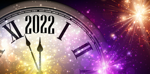 Fototapeta na wymiar Half hidden clock showing 2022 with sparkling fireworks.