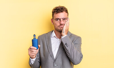 young handsome man feeling bored, frustrated and sleepy after a tiresome. vaporizer concept