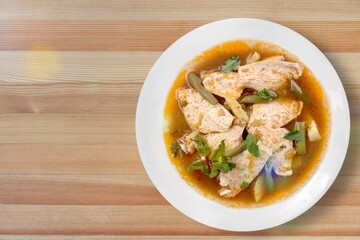 Dum chicken biriyani, serving bowl and garnished on the desk
